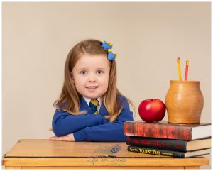 Primary 1 child school desk with books Life in Focus Portraits school and nursery photography JLB school Helensburgh