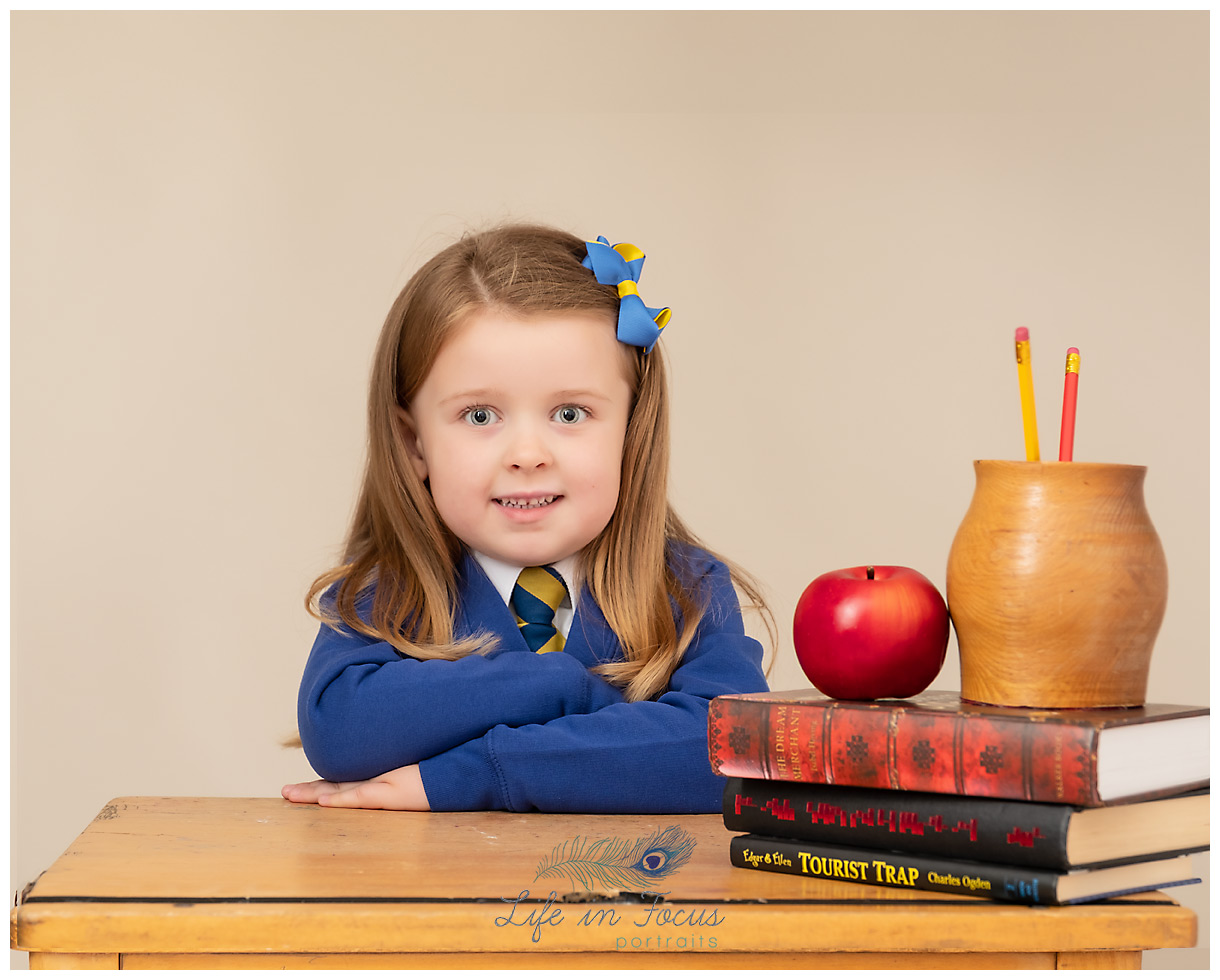 Primary 1 child school desk with books Life in Focus Portraits school and nursery photography JLB school Helensburgh Primary 1 child school desk with books Life in Focus Portraits school and nursery photography JLB school Helensburgh
