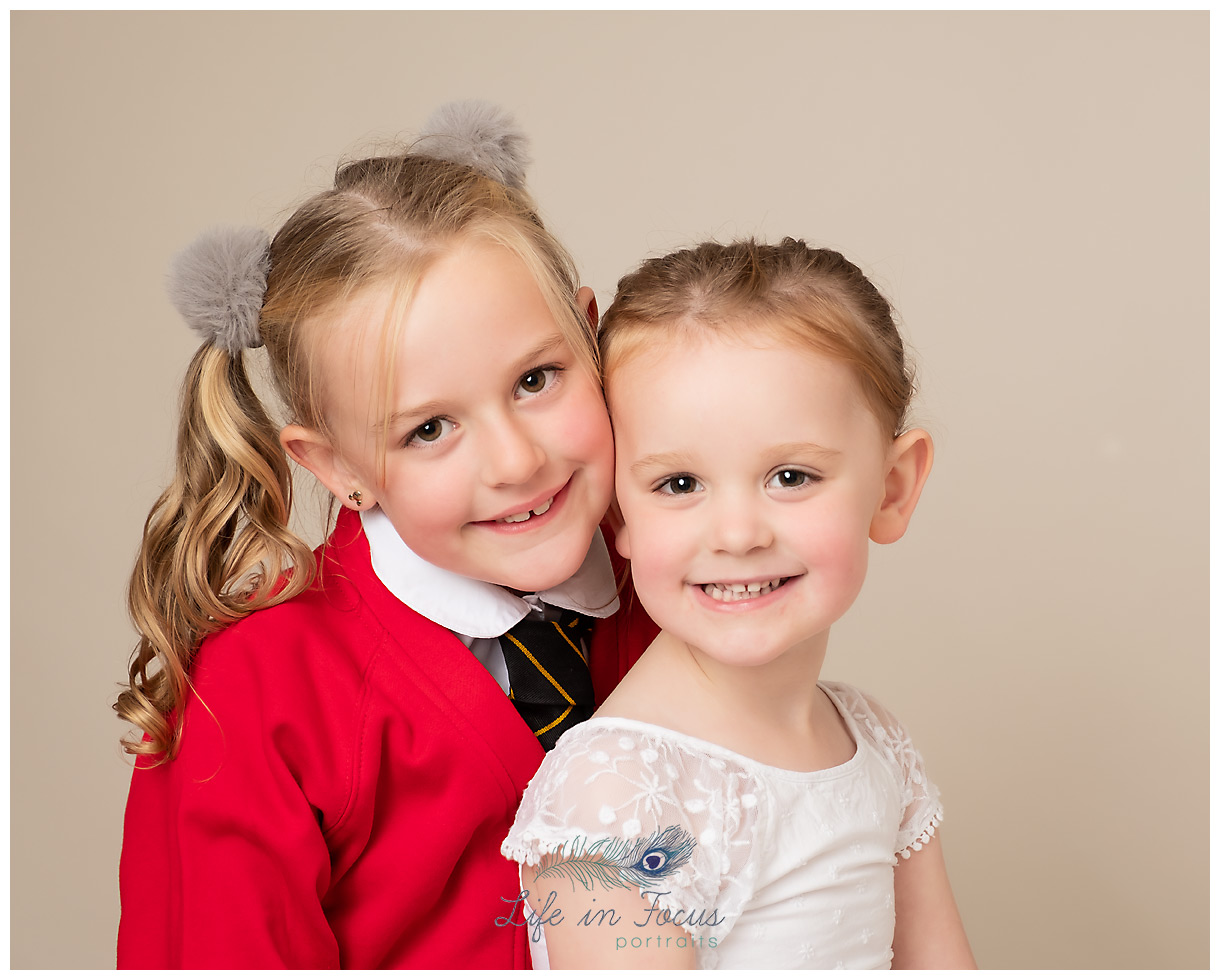 sisters siblings school photograph Colgrain primary school Helensburgh Life in Focus Portraits school and nursery photographer Rhu Argyll and Bute