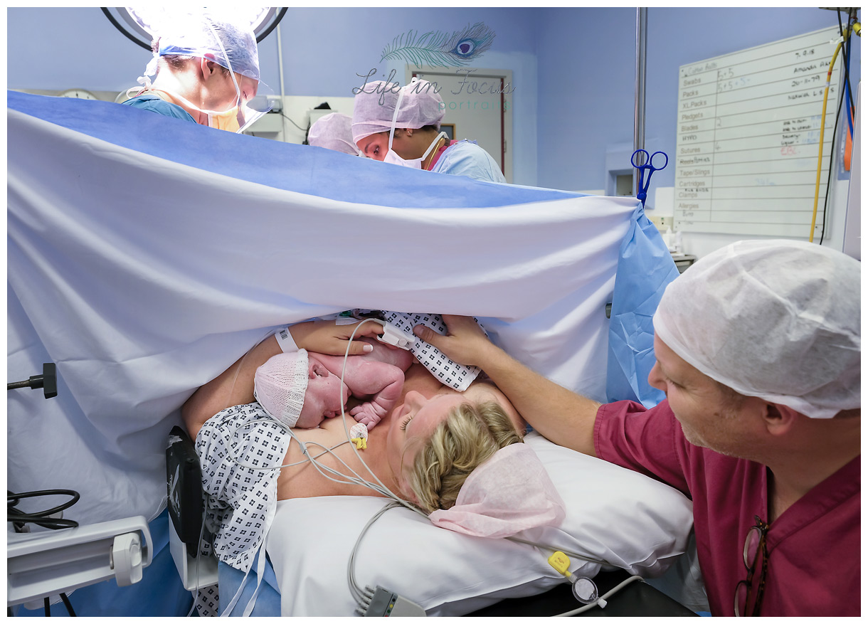 Mum cradles newborn for skin to skin following natural c-section Life in Focus Portraits birth photographer Glasgow hospitals