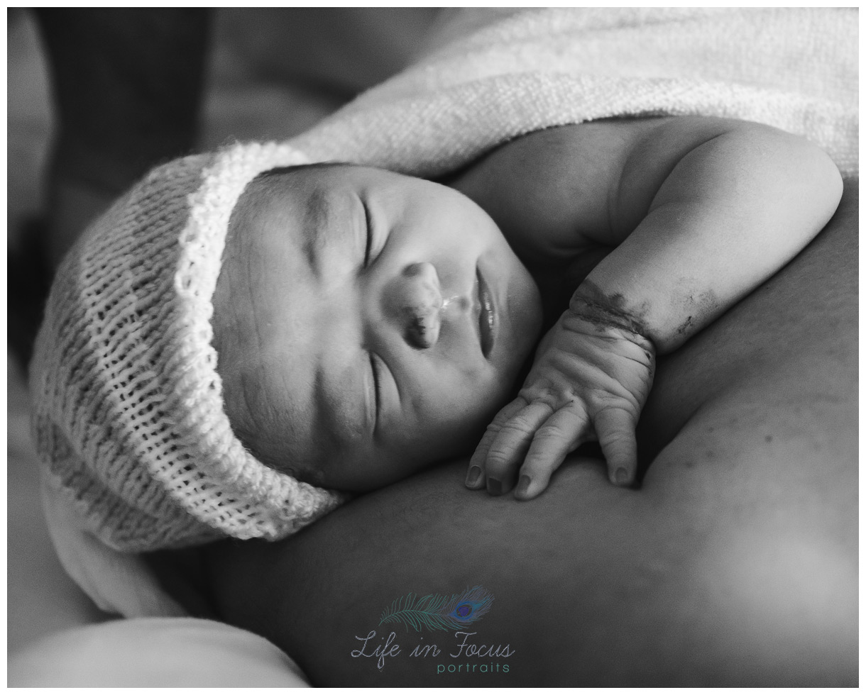brand new baby in hat shortly after birth Life in Focus Portraits birth and fresh 48 photography Helensburgh Argyll and Bute