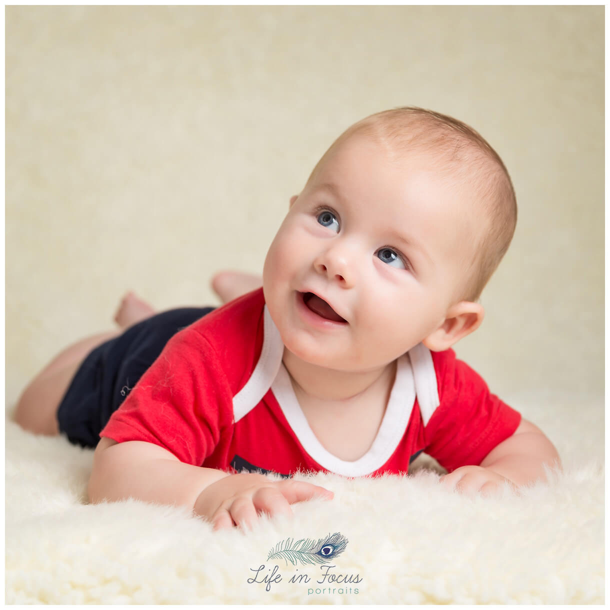 smiling baby boy tummy time photoshoot Life in Focus Portraits Helensburgh baby photographer