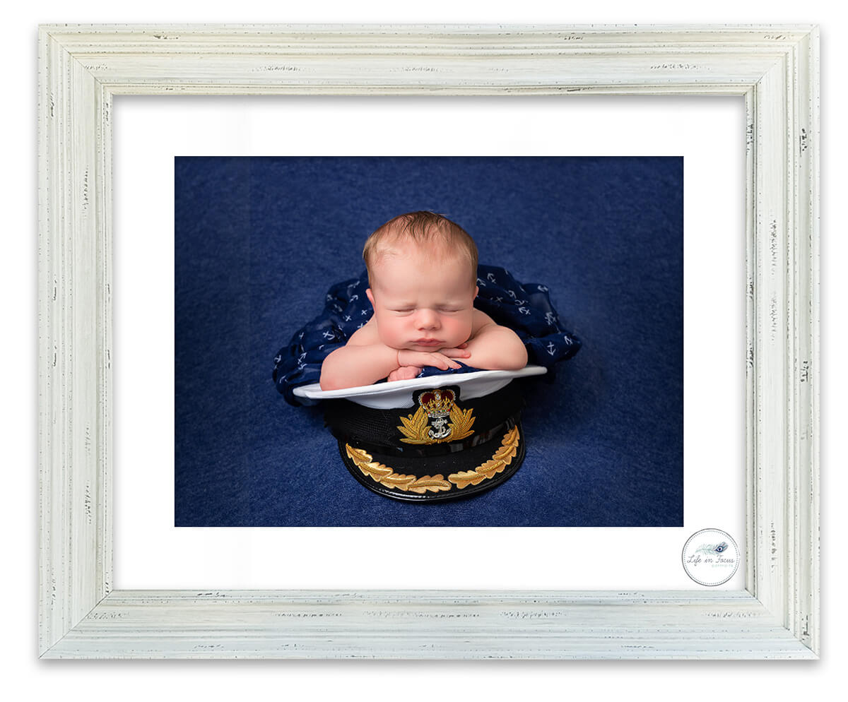Newborn baby boy on Dad's Royal Navy Commander Cap HMNB Clyde Faslane Naval Base Life in Focus Portraits newborn baby photographer Helensburgh