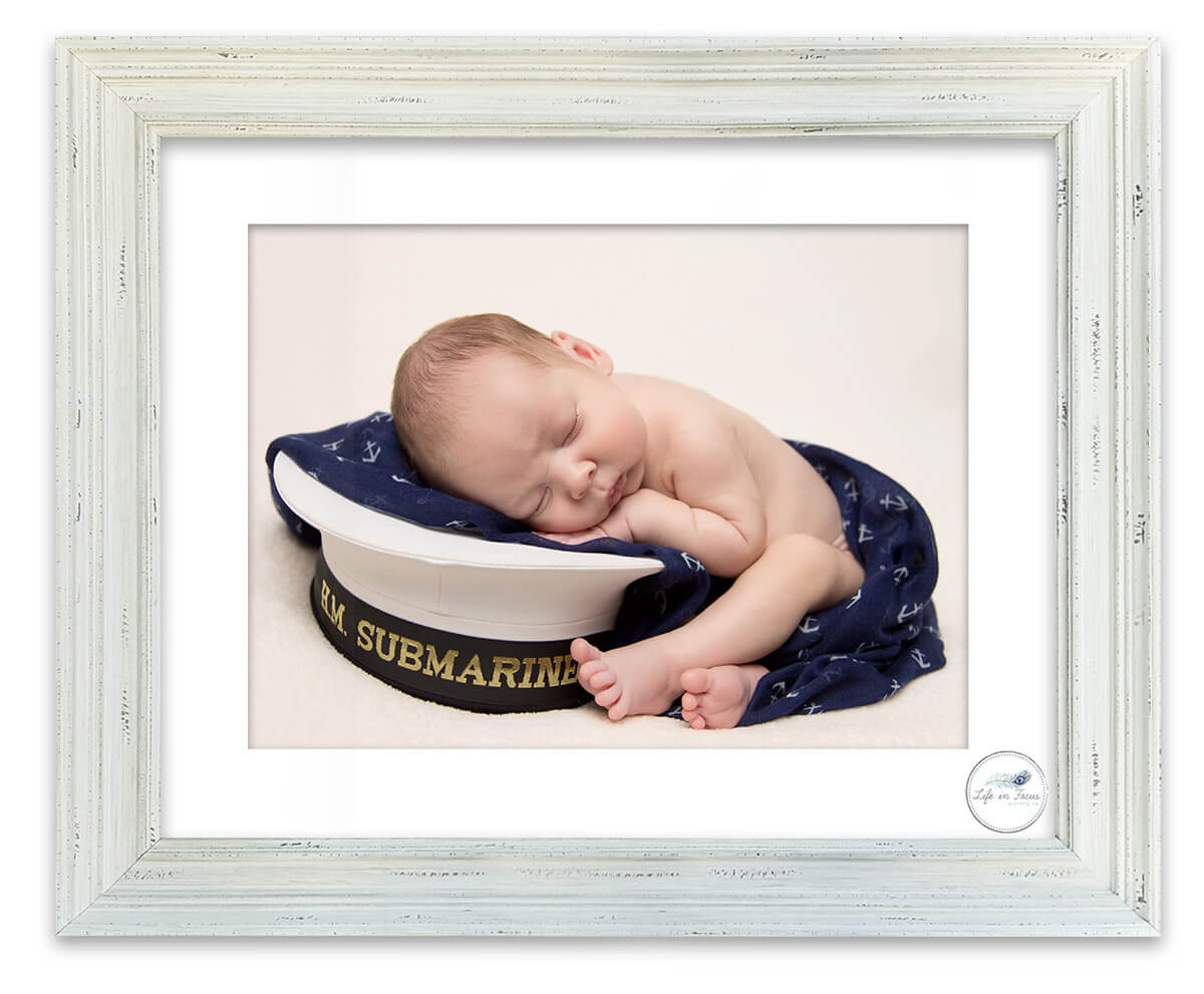 Royal Navy Submariner baby on daddys cap Life in Focus Portraits newborn baby photographer Rhu Helensburgh Garelochhead