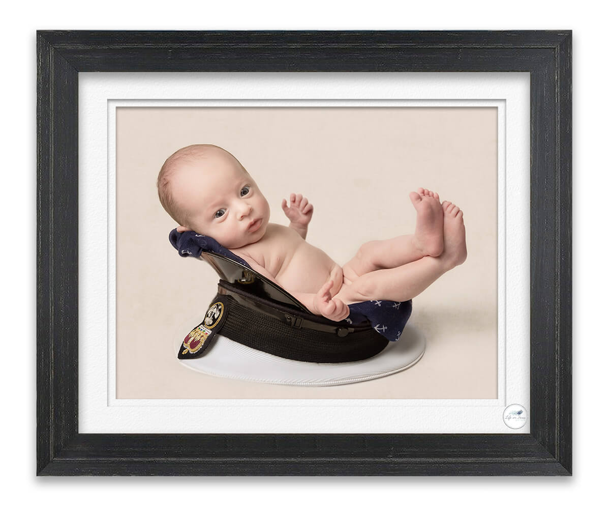 Royal Navy newborn baby in dads submariner cap Life in Focus Portraits newborn baby photo studio Rhu Helensburgh HMNB Clyde