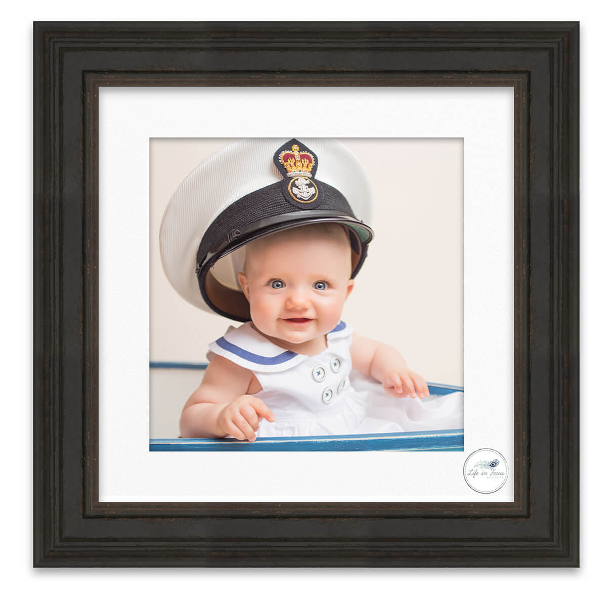 baby girl in Dad's submariner cap Life in Focus Portraits baby photographer Helensburgh Faslane Rhu Garelochhead