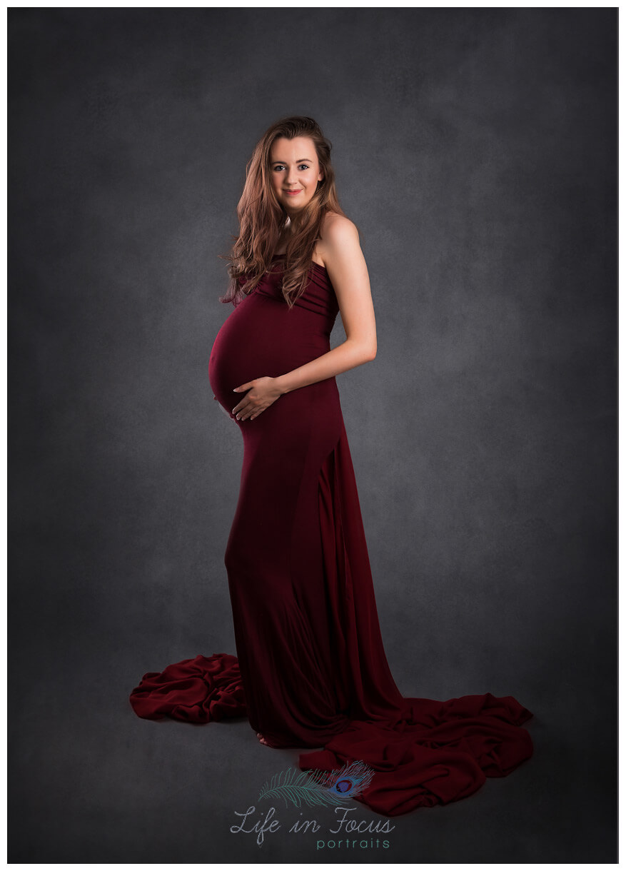 mum to be photo shoot pregnant mum in red maternity dress Life in Focus Portraits studio Rhu Helensburgh