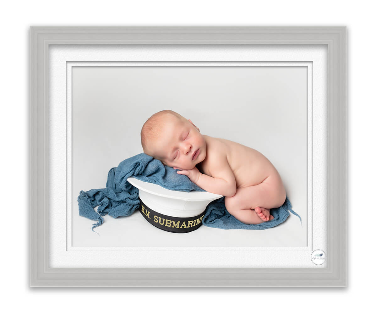 newborn baby boy on royal navy Cap Life in Focus Portraits newborn baby photo studio Faslane Naval Base Rhu Helensburgh