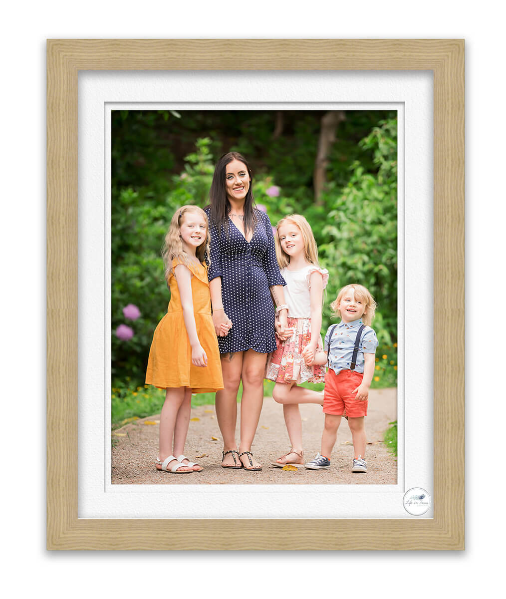 photo of family standing together in park Life in Focus Portraits Helensburgh outdoor photographer