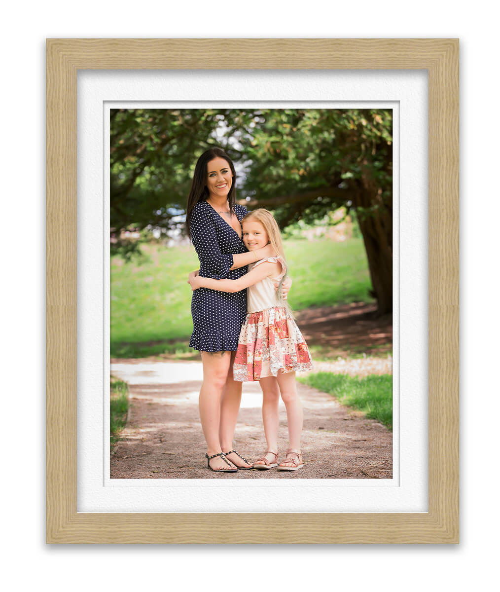 photo of mum with young daugher standing under tree in park Life in Focus Portraits family photoshoots Rhu Helensburgh Cardross