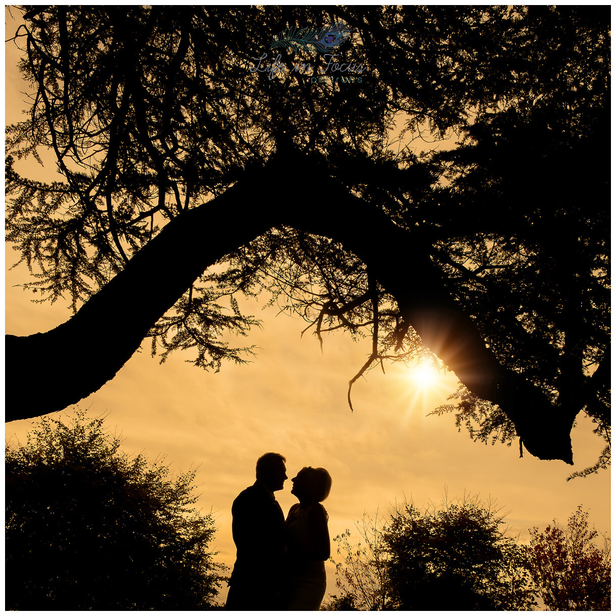 Sunset silhouette wedding photo Life in Focus Portraits Loch Lomond Wedding Photographer sunset silhouette photo of bride and groom on wedding day Rhu Helensburgh Elopement Micro Wedding